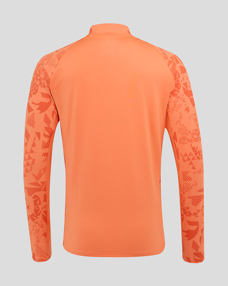 Back view of melon orange long sleeve midlayer top with abstract print on the sleeves.