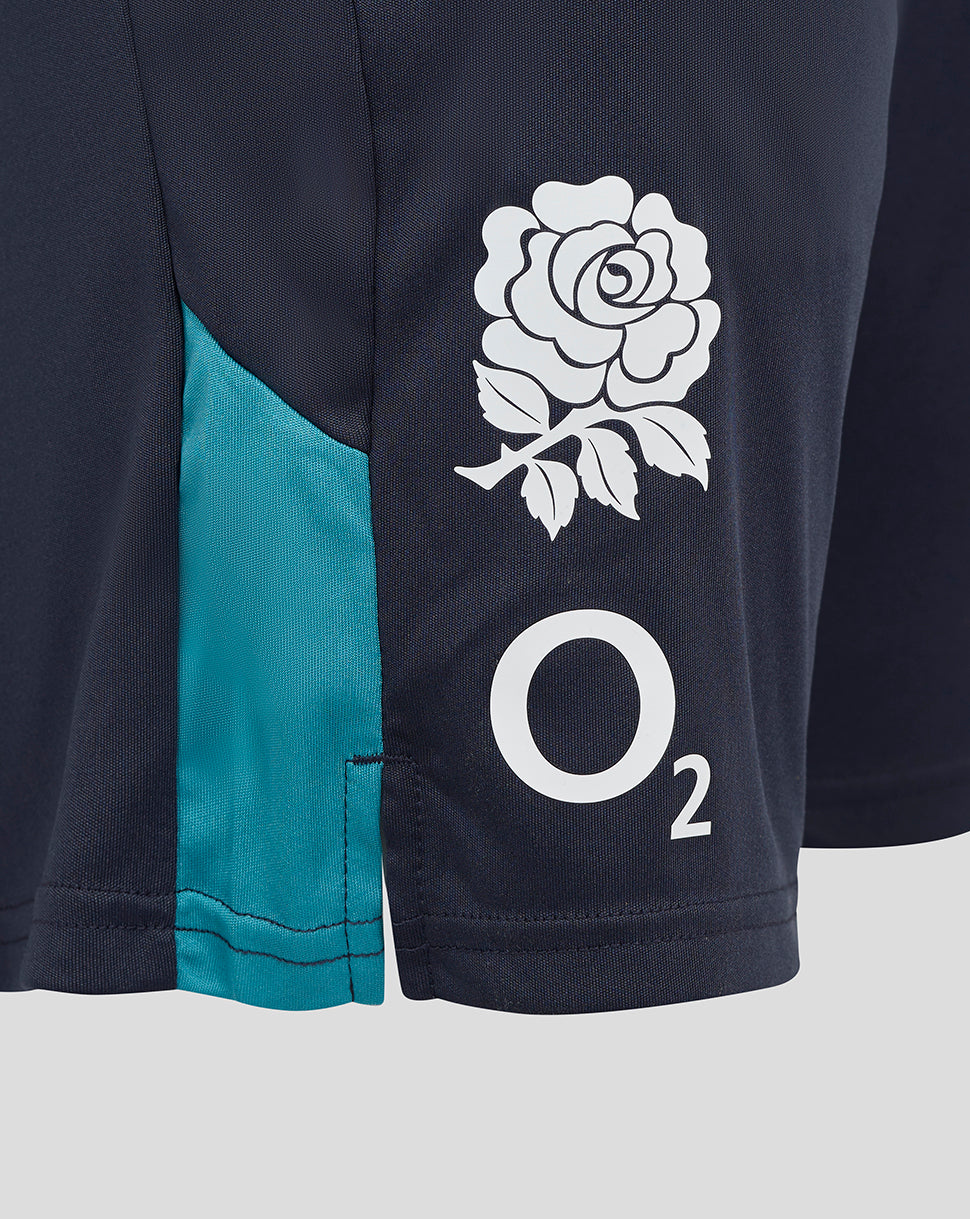 Close up of navy shorts showing the white rose crest and O2 logo on the right thigh with turquoise side panel.