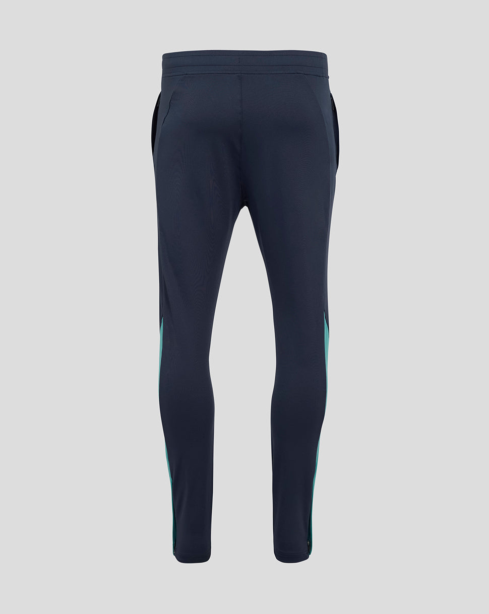 Back view of navy England Rugby knit pants with elastic waistband and teal side panels.