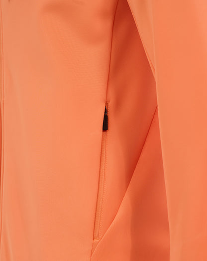 Close-up of orange Melon fabric with a visible zipper and seam on a men's England Rugby performance hoodie