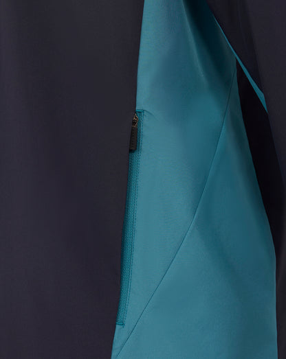 Navy shower jacket side with teal panel and zip pocket detail