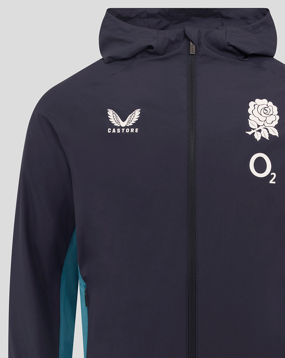 Front close-up of navy shower jacket showing Castore logo on left chest and rose crest with O2 logo on right chest