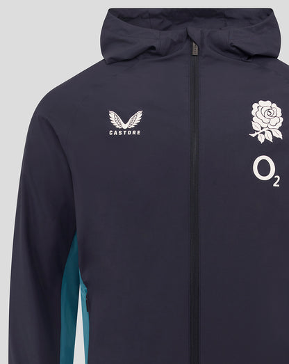 Front close-up of navy shower jacket showing Castore logo on left chest and rose crest with O2 logo on right chest