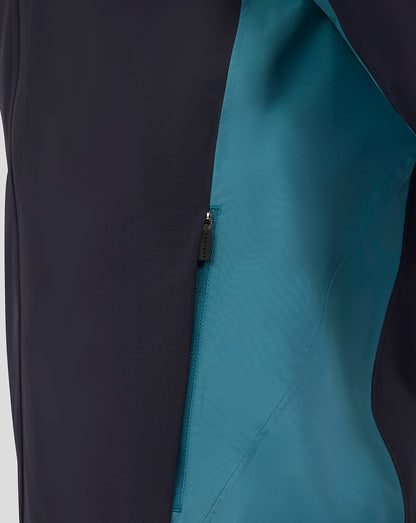 Close-up of zipped teal side panel on navy lightweight rain jacket