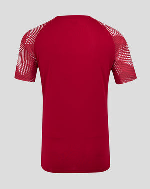 Back view of bold red England Rugby pre match short sleeve T shirt with geometric sleeve print and dropped back hem