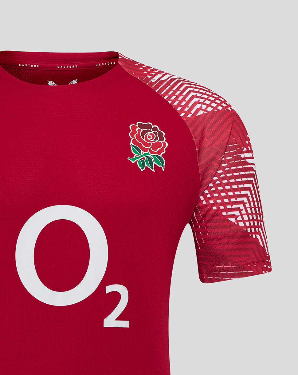 Detail of red England Rugby pre match shirt showing Rose crest on chest O2 logo and Castore branding with geometric sleeve pattern