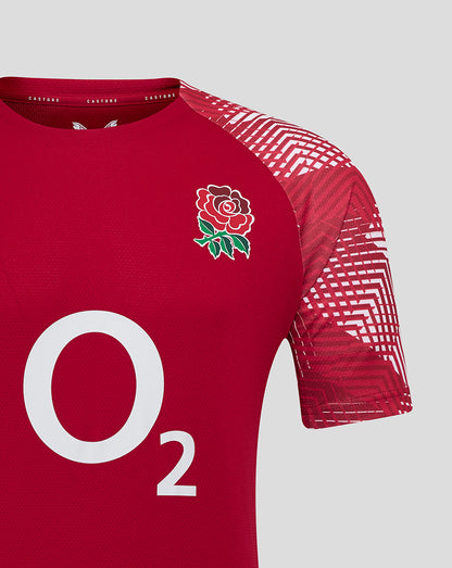 Detail of red England Rugby pre match shirt showing Rose crest on chest O2 logo and Castore branding with geometric sleeve pattern