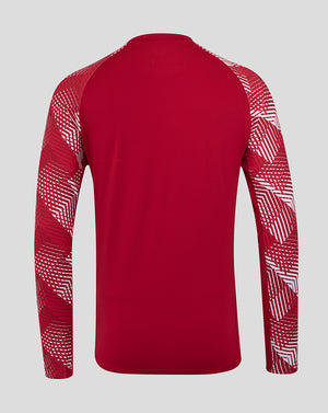 Back view of red England Rugby pre match long sleeve top with geometric white pattern on the sleeves