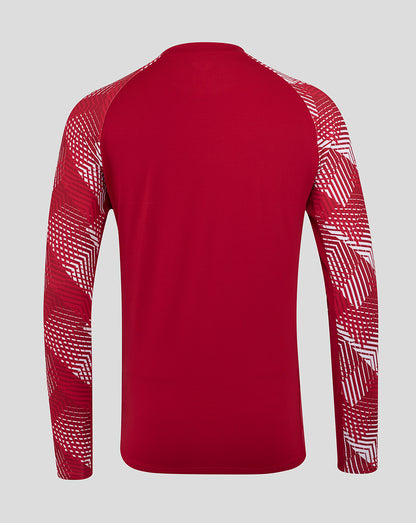 Back view of red England Rugby pre match long sleeve top with geometric white pattern on the sleeves