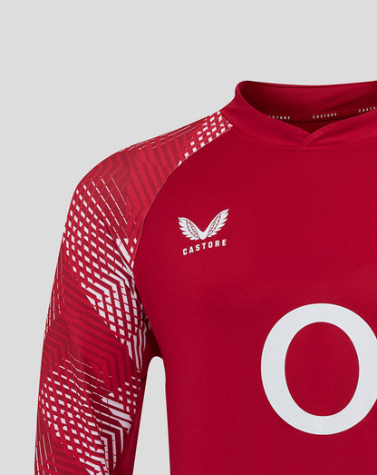 Close up of red England Rugby drill top showing Castore logo on the chest and geometric sleeve pattern