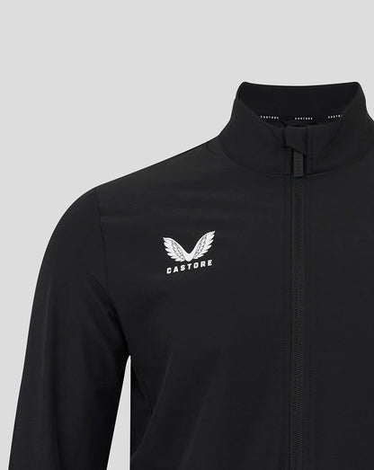 Close up of black England Rugby Alternate Anthem jacket showing white wing crest and Castore logo on the chest beside the zipper