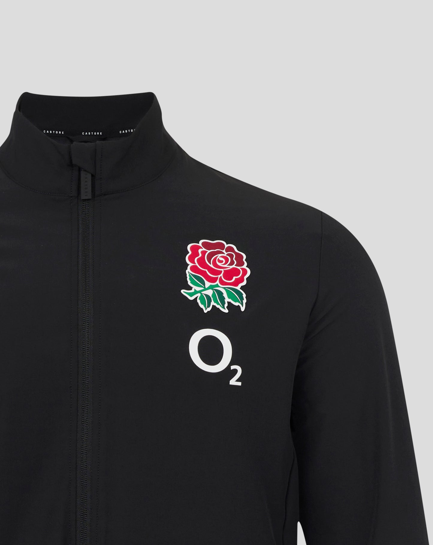 Close up of black England Rugby Alternate Anthem jacket with a red rose crest on the chest and front zipper