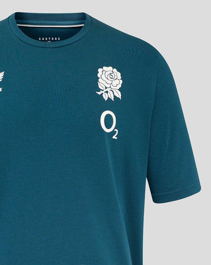 Close up of teal England Rugby travel tee with rose crest on left chest and O2 logo on right chest