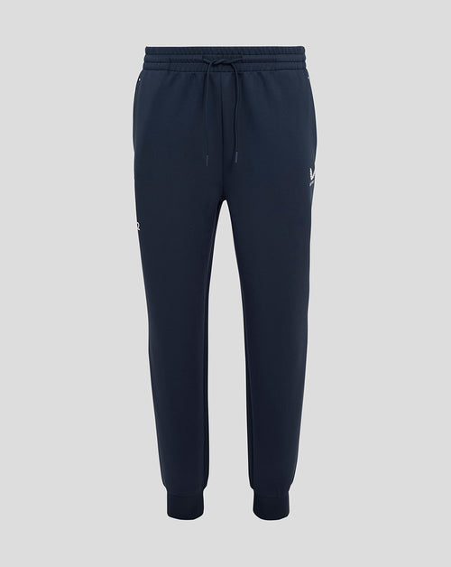 Navy England Rugby Travel Knit Pant with external drawcords, ribbed cuffs, side zip pockets and thigh logos.