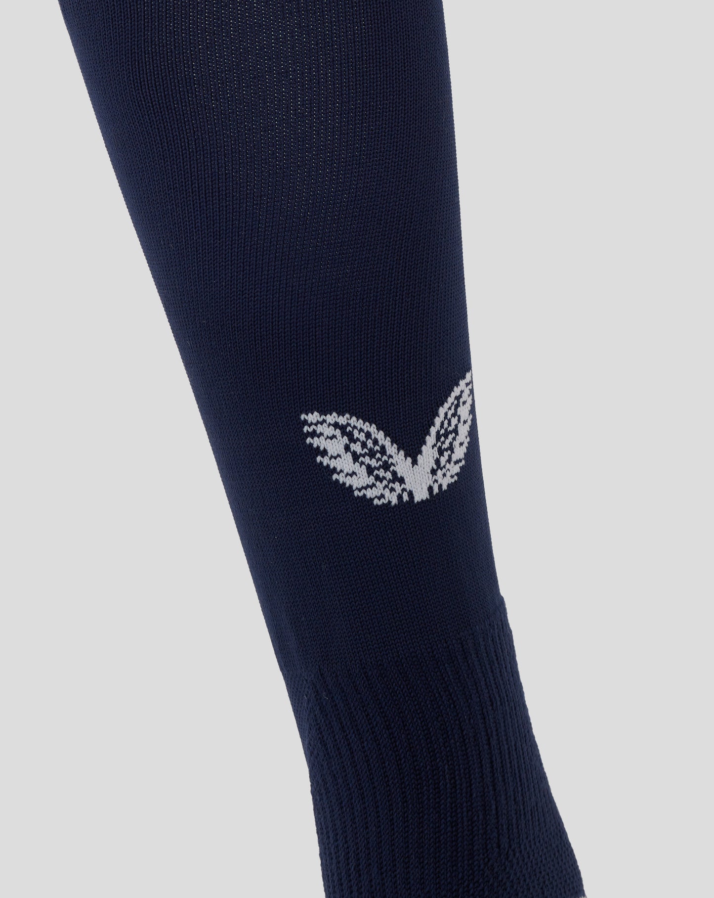 Angled view of navy England Rugby home sock featuring white knit pattern near ankle and contrasting cuff.