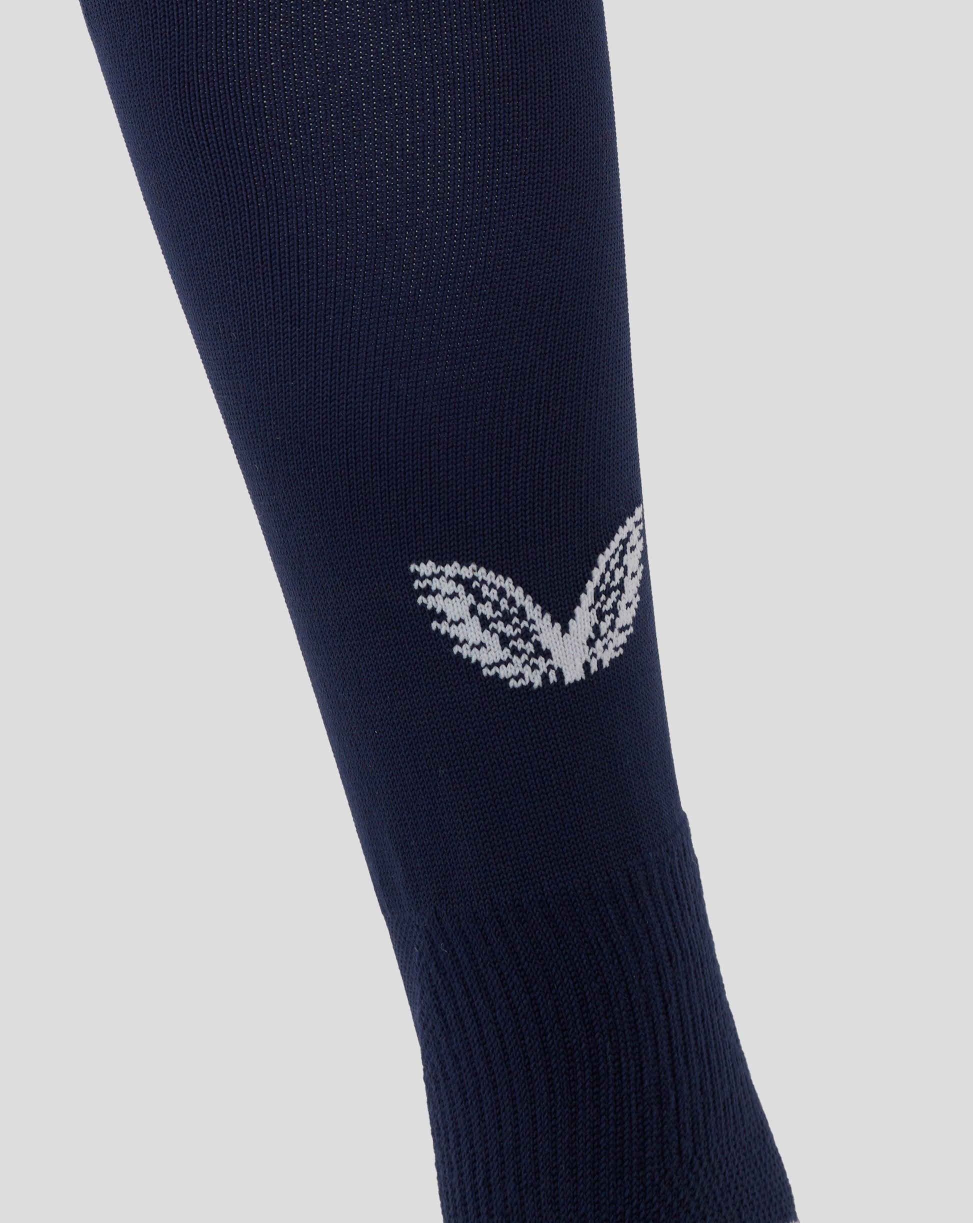 Angled view of navy England Rugby home sock featuring white knit pattern near ankle and contrasting cuff.