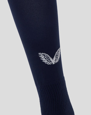 Close up of navy peacoat Junior England Rugby Home Sock with knit texture and white Castore logo on the back leg