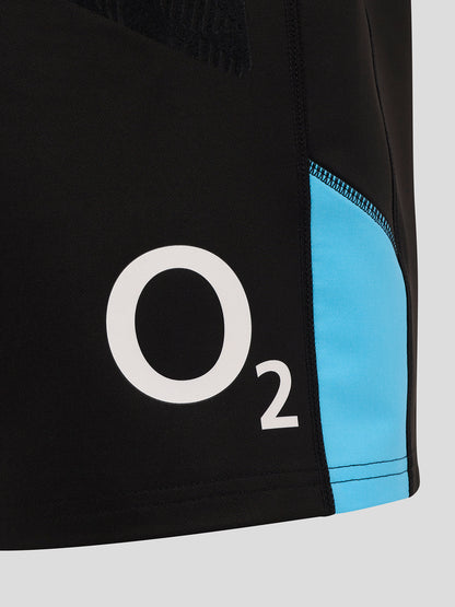 Close-up of black shorts side panel with bright blue accent and visible O2 logo