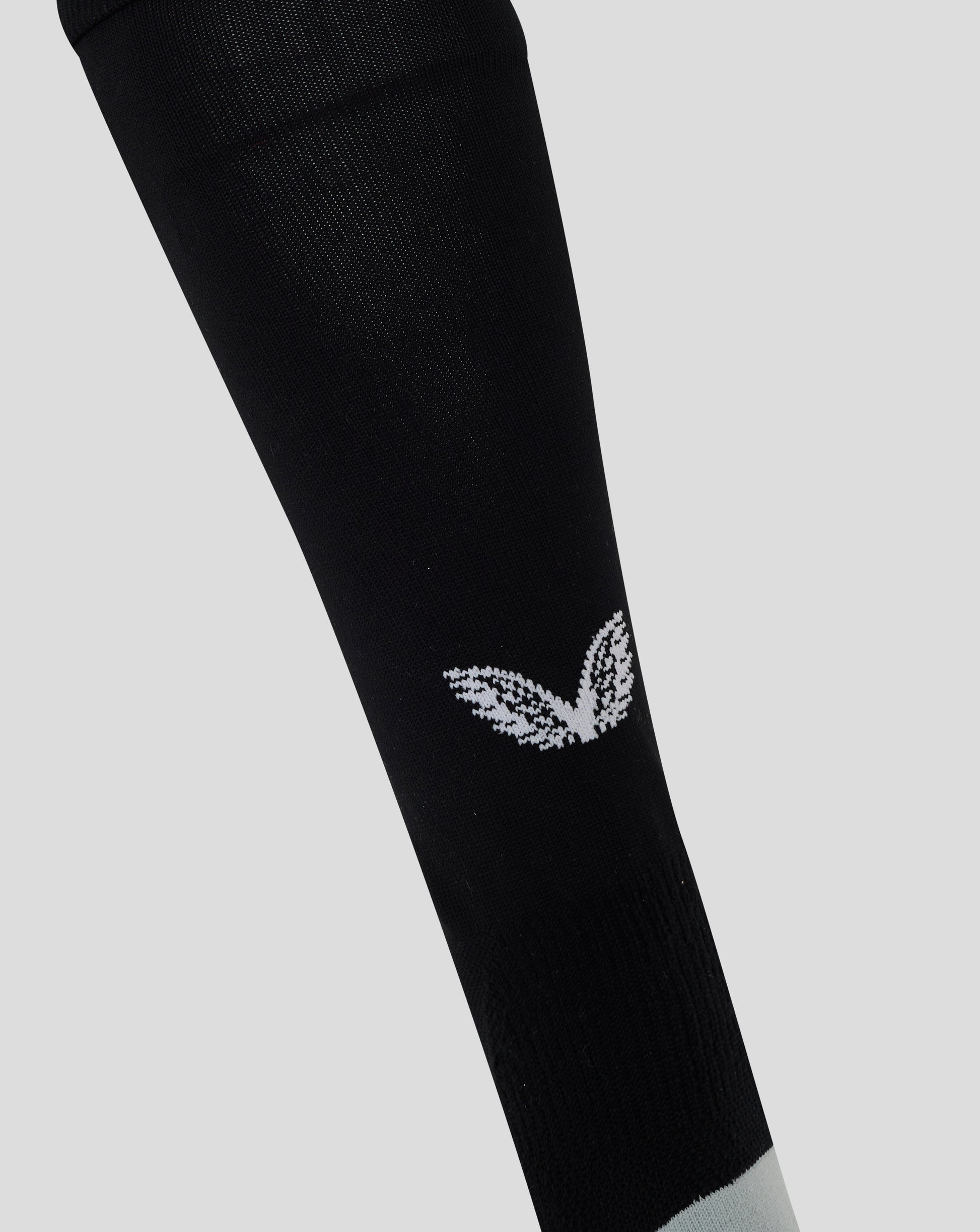 Close-up of black Men’s England Rugby Alternate Full Foot Sock in Caviar with textured knit and white Castore branding near the ankle.