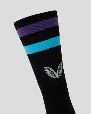 Black mid calf rugby sock with purple and turquoise hoops and Castore logo on the back leg