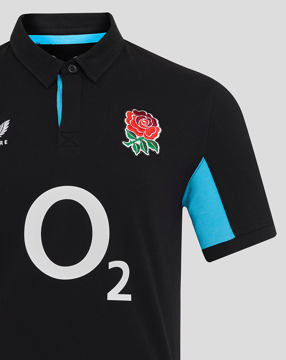 Close up of chest area on Men’s England Rugby Alternate Classic Short Sleeve Shirt with rose crest left chest and large O2 logo center plus turquoise sleeve panels