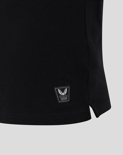 Bottom hem detail of black rugby shirt with a small Castore authenticity patch