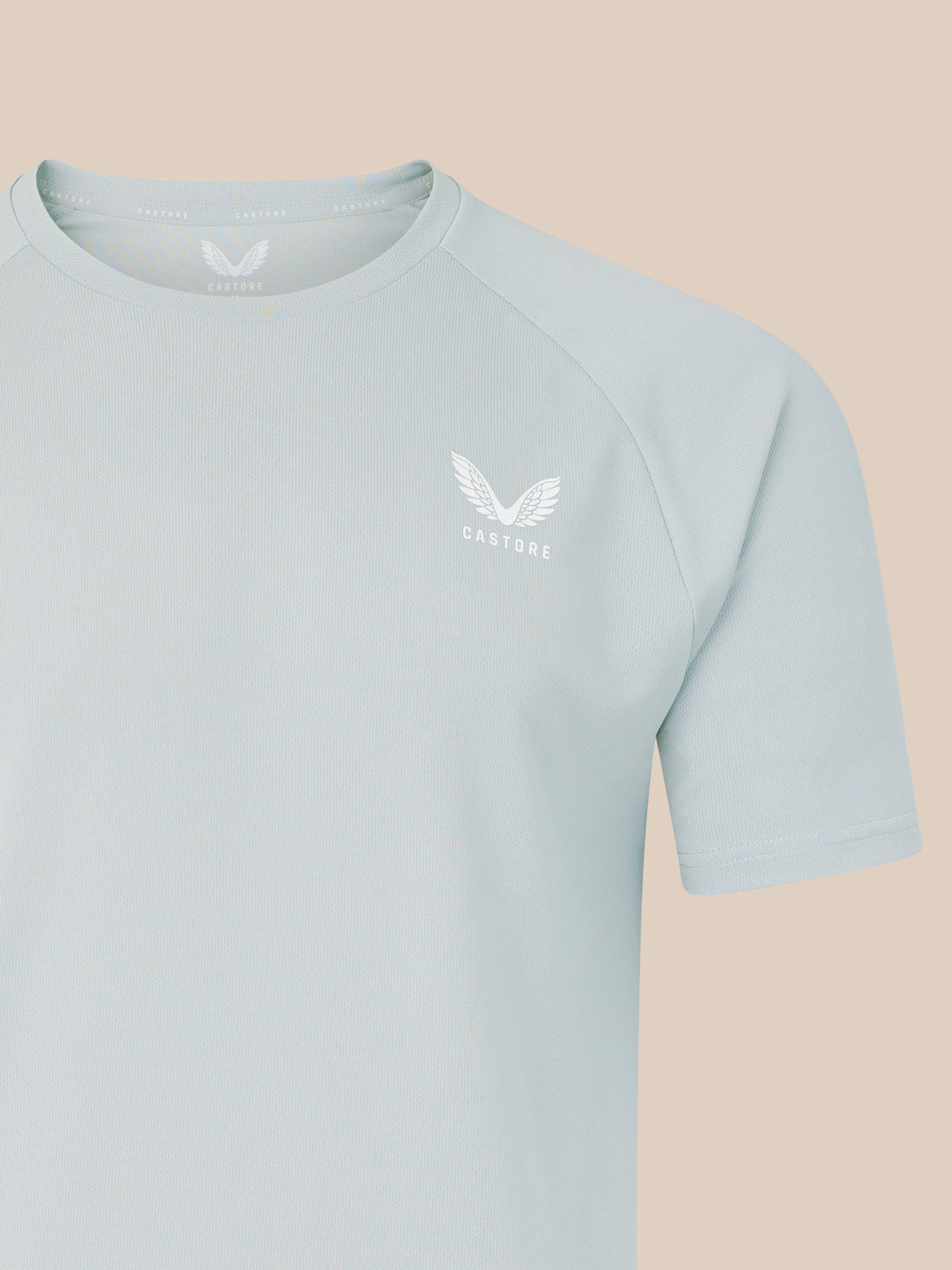 Grey men's logo T shirt with white crest on left chest.