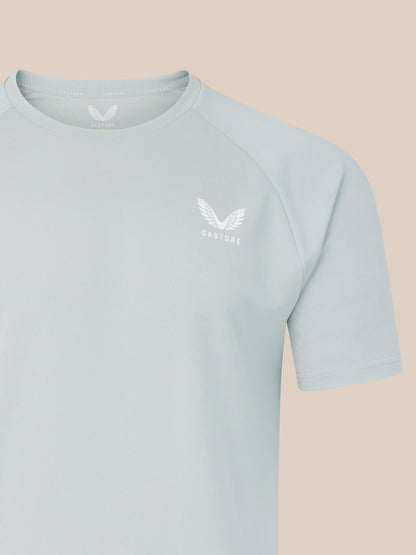 Grey men's logo T shirt with white crest on left chest.