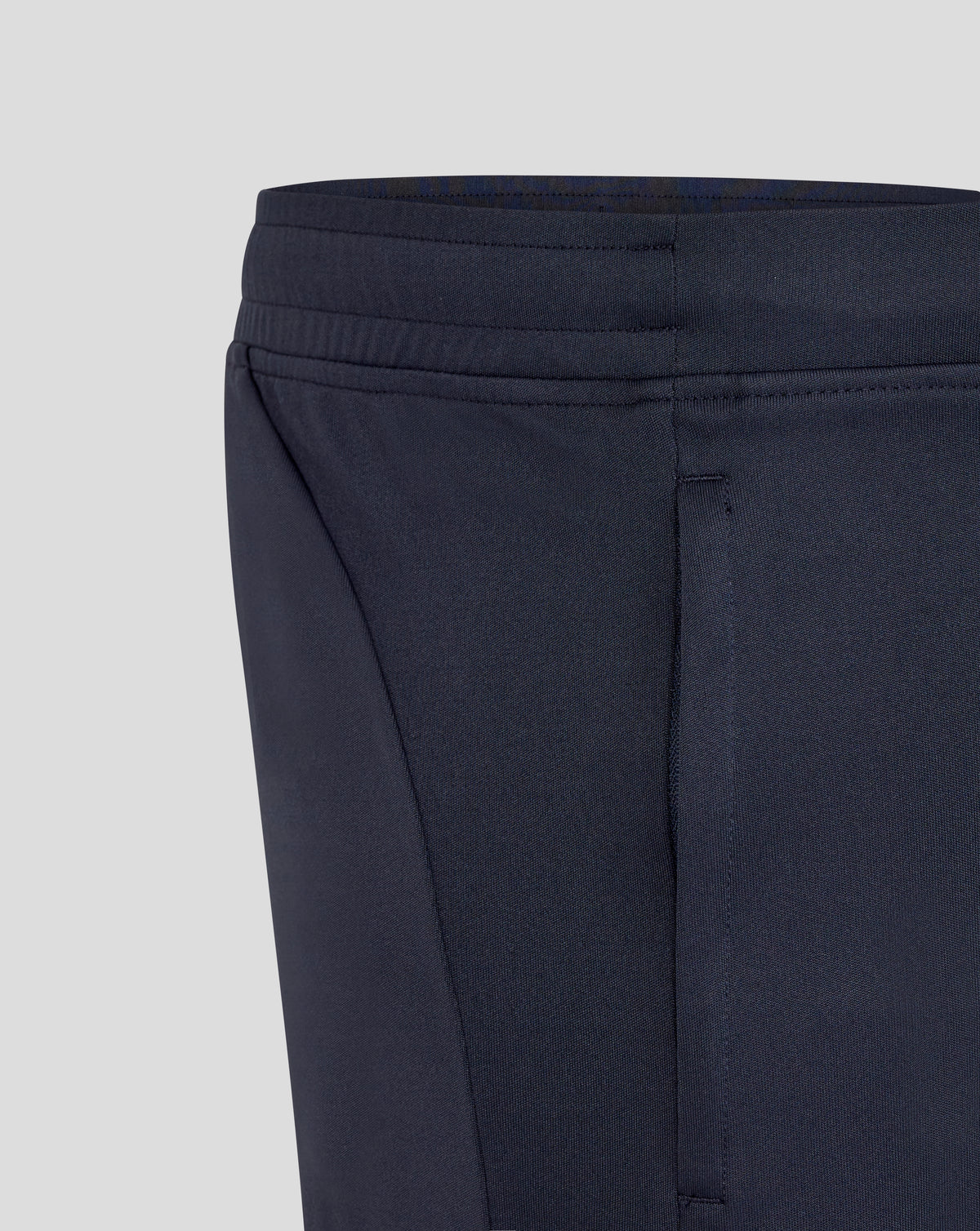 Close-up of navy England Rugby men's performance knit shorts waist area with stitching details