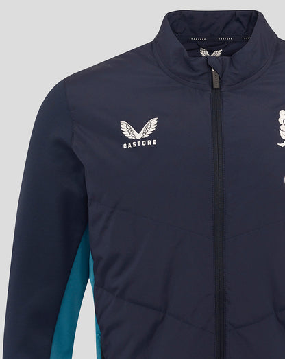 Close-up of navy jacket chest showing Castore logo on left chest