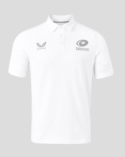 Front view of white Saracens travel polo with Castore logo on the left chest and Saracens emblem on the right.
