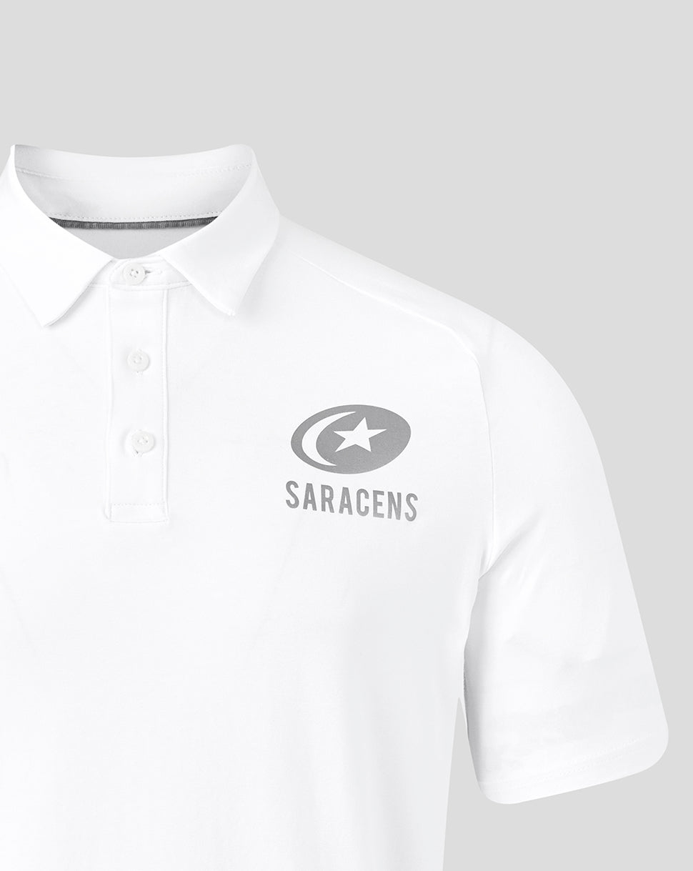 Close-up of the Saracens crest on the chest of a white polo shirt.