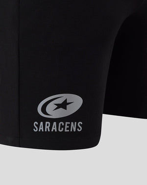 Saracens logo and name on the leg of black travel shorts