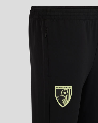 Close up of black athletic pants showing a zippered side pocket and an elastic waistband