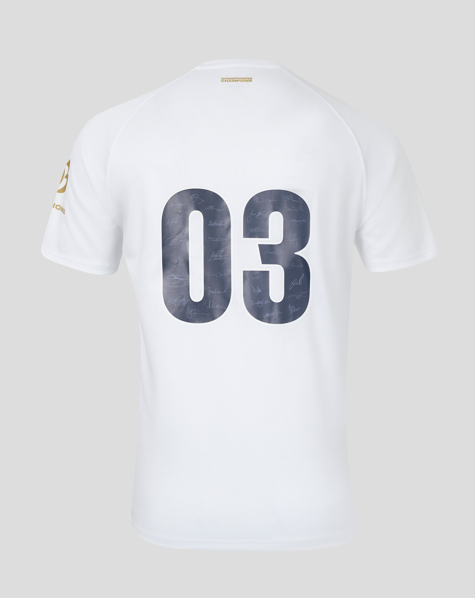 Back view of a white replica jersey with large 03 numbers filled with signatures and a small gold Champions label at the neckline.