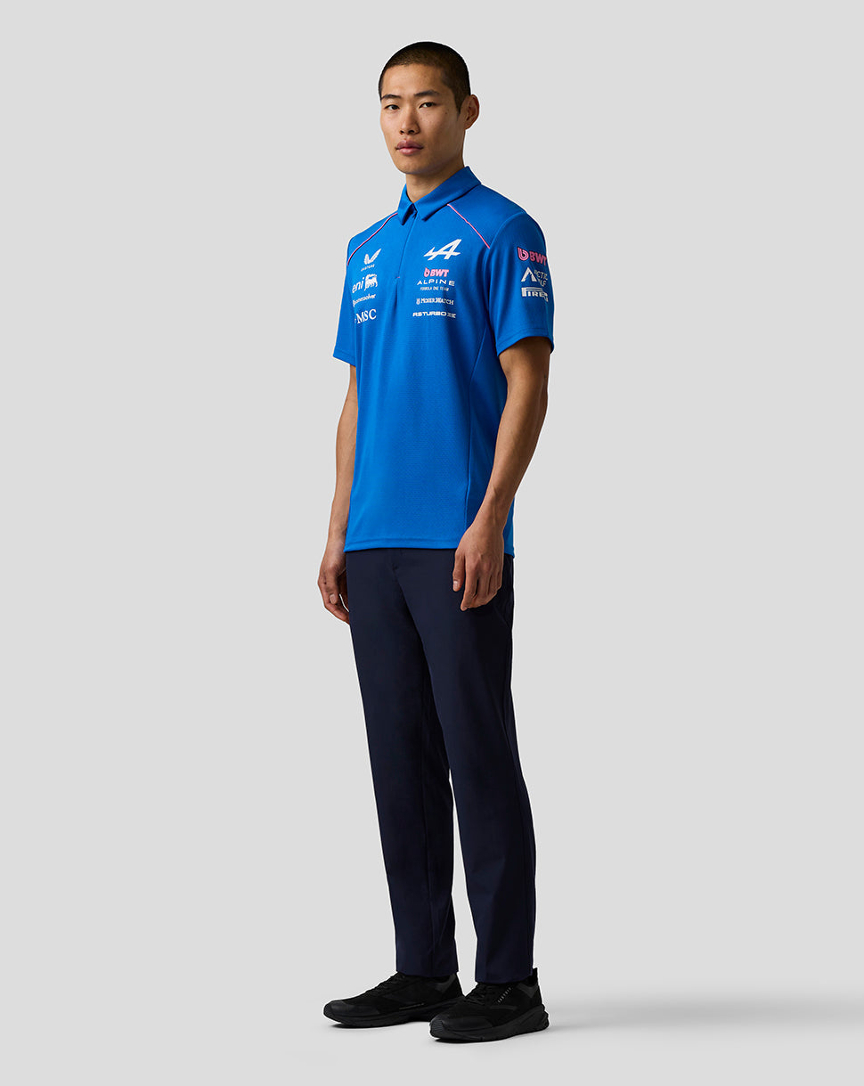 Full body shot of a male model wearing the Official Men’s BWT Alpine polo shirt in blue with sponsor logos.