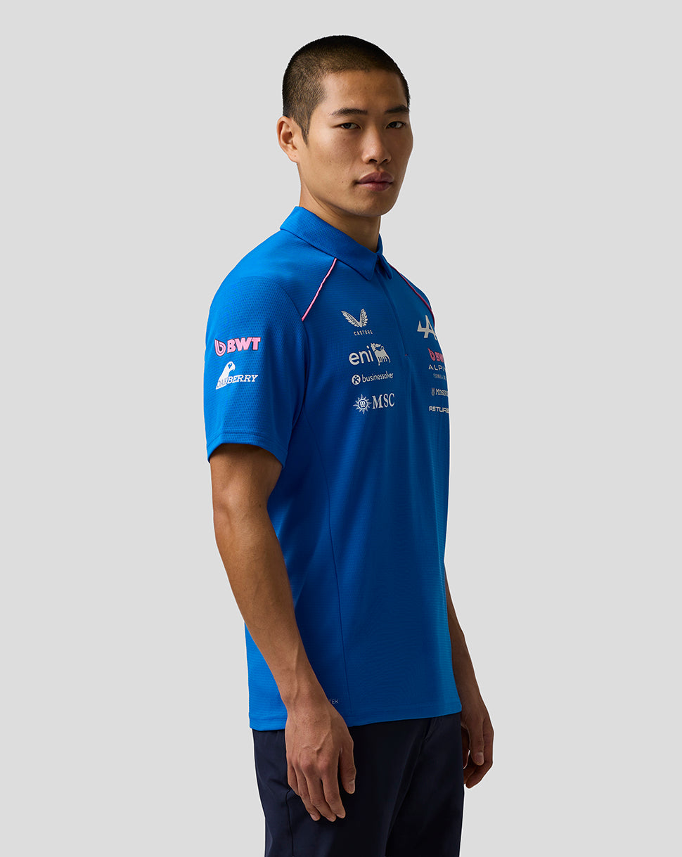 Side profile of a male model in the blue BWT Alpine polo shirt with team logos.