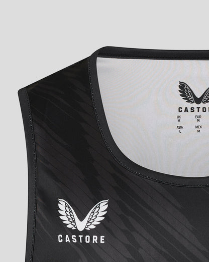 Close-up of black Leicester Tigers vest chest showing Castore logo and tiger head emblem