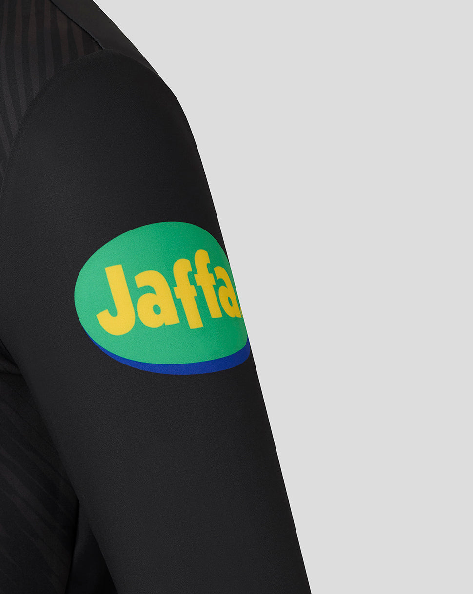 Left sleeve of a black Leicester Tigers training top with a green oval sponsor patch featuring Jaffa