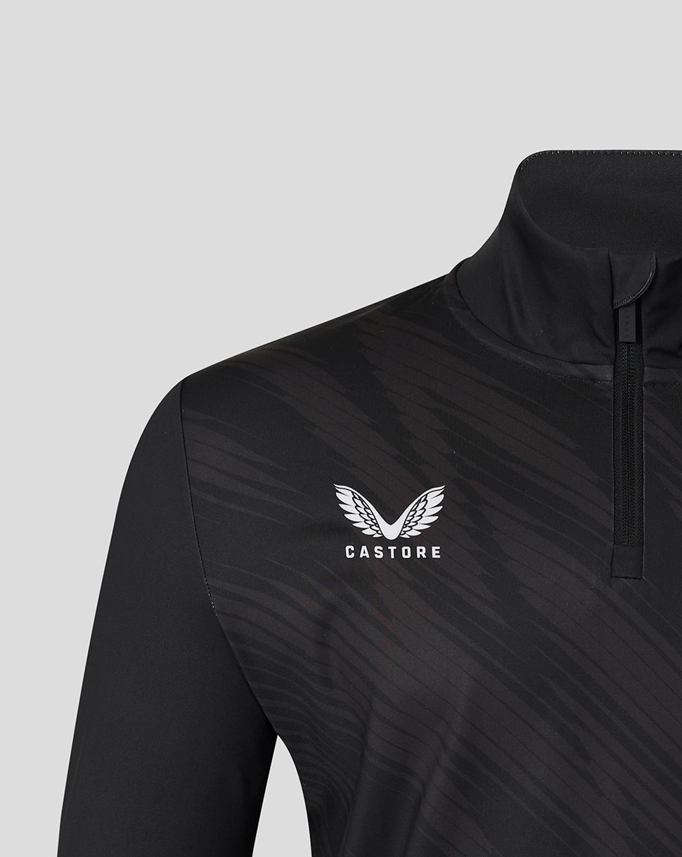 Close-up of the chest area on a black Leicester Tigers training top showing the Castore logo and diagonal pattern.