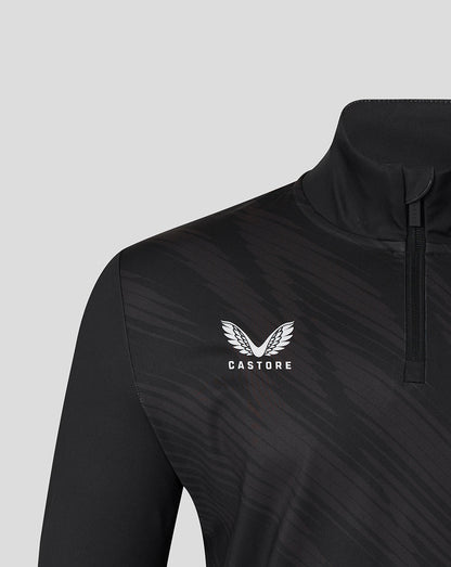 Close-up of the chest area on a black Leicester Tigers training top showing the Castore logo and diagonal pattern.