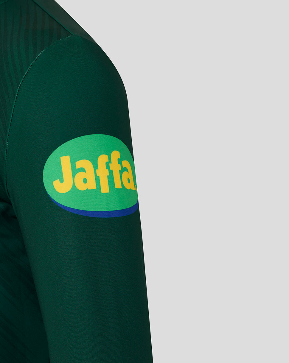 Long sleeve dark green training top with round Jaffa logo patch on the upper sleeve