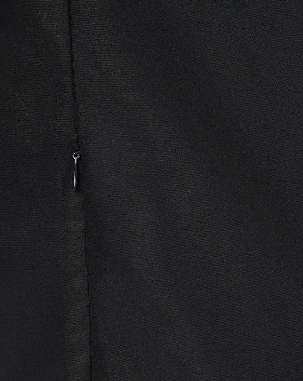 Close up of black jacket front showing a vertical zipper and smooth fabric