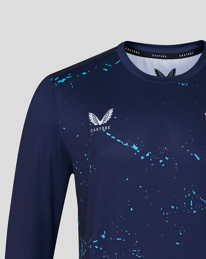 Close up of navy Peacoat long sleeve performance T shirt showing Castore logo on chest with turquoise splatter