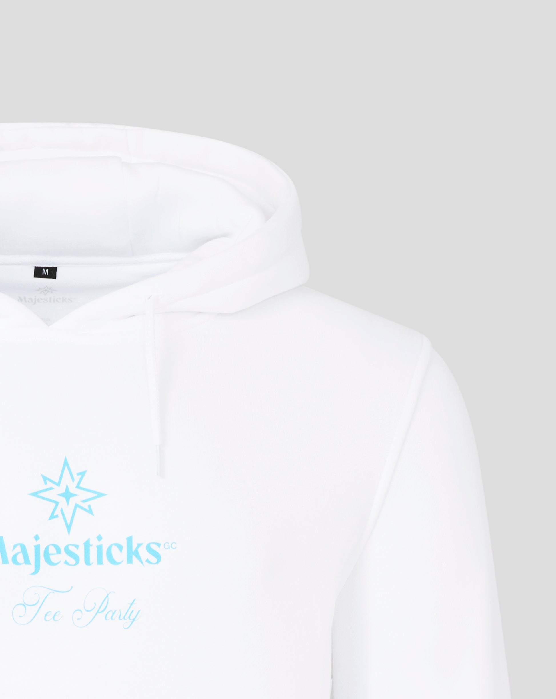 Close up of white Majesticks hoodie hood with size M tag at the neck and a faint interior logo