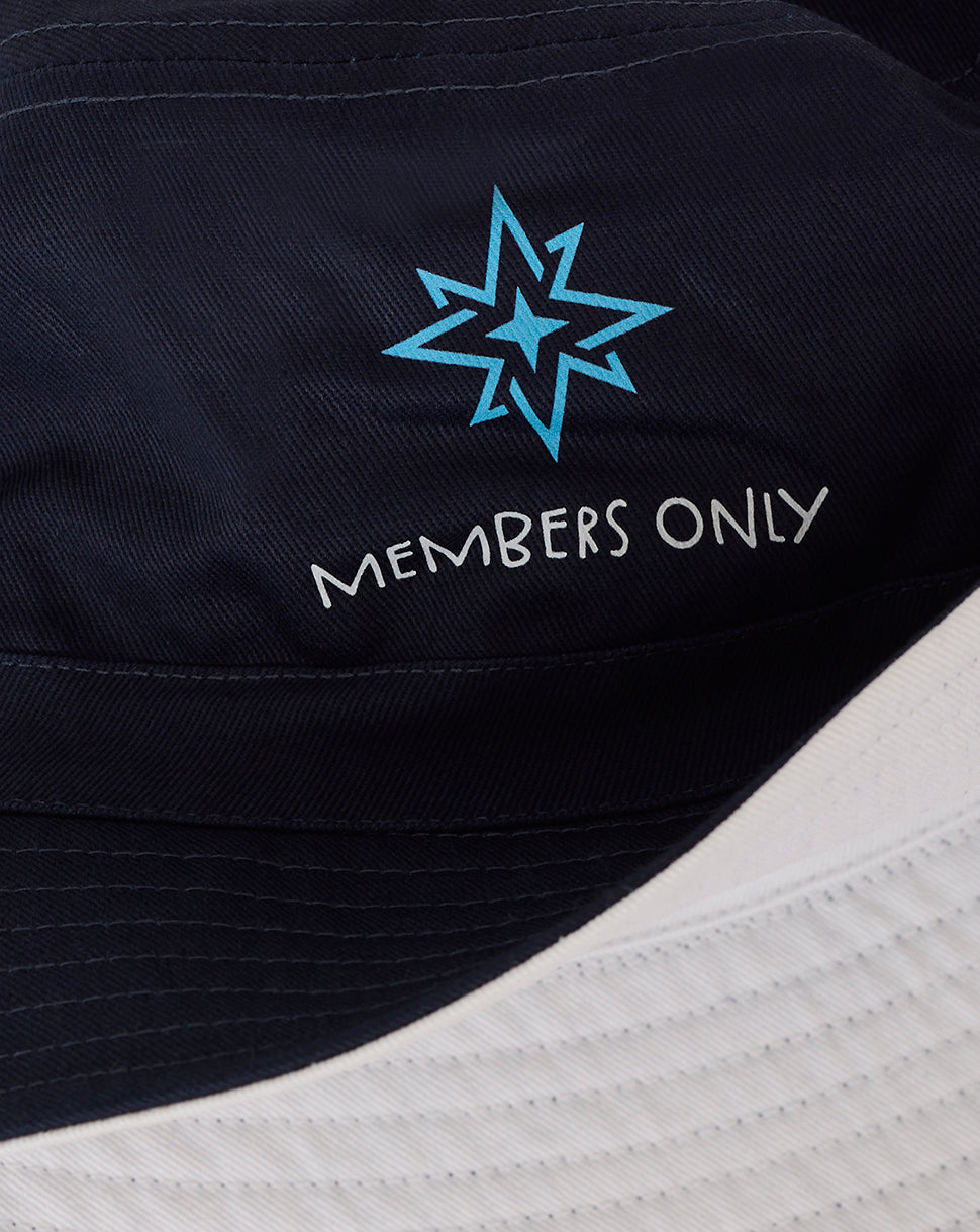 Navy Majesticks reverse bucket hat with a light blue star logo and Members Only branding.