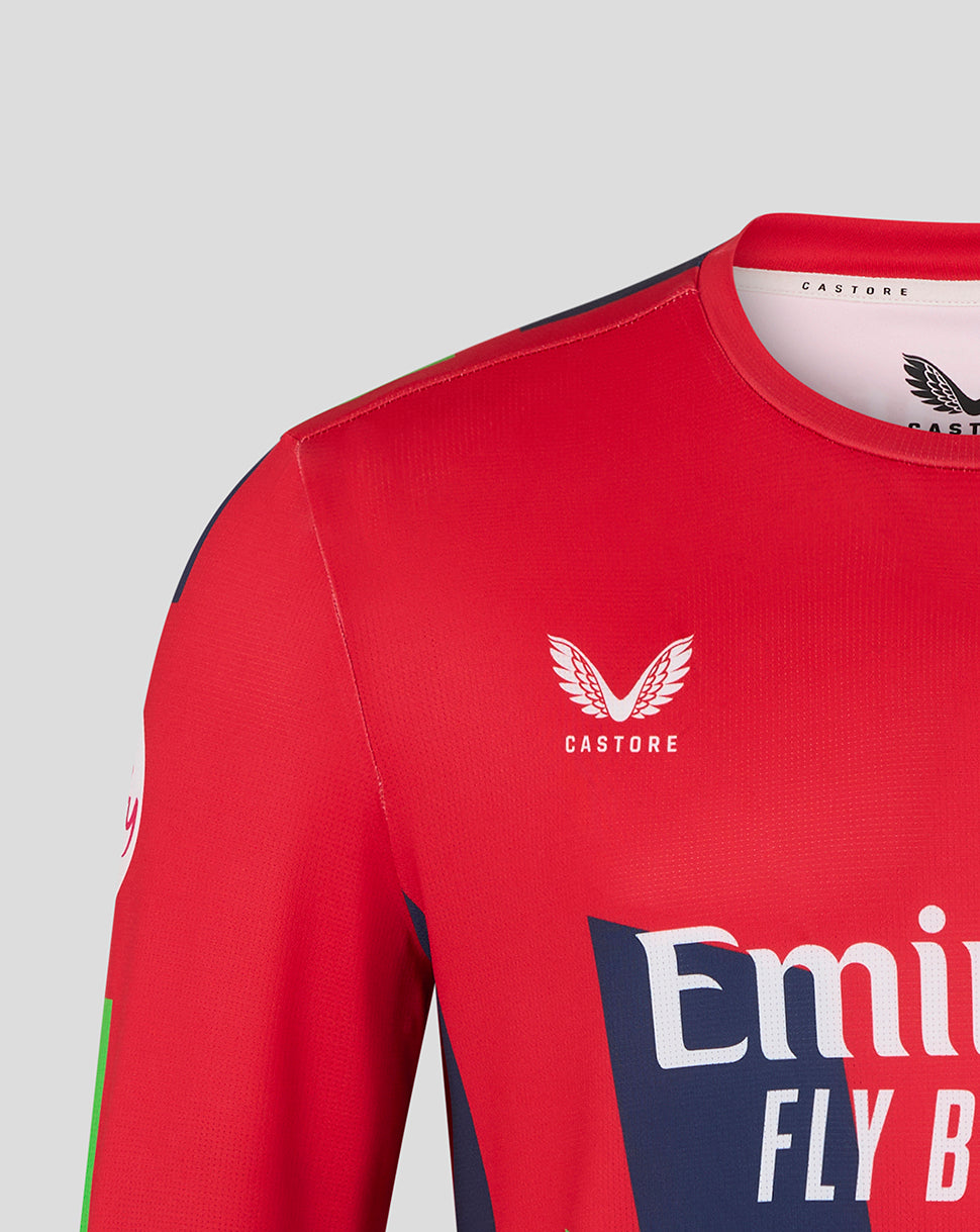 Red sports jersey with Castore and Emirates logos on a gray background