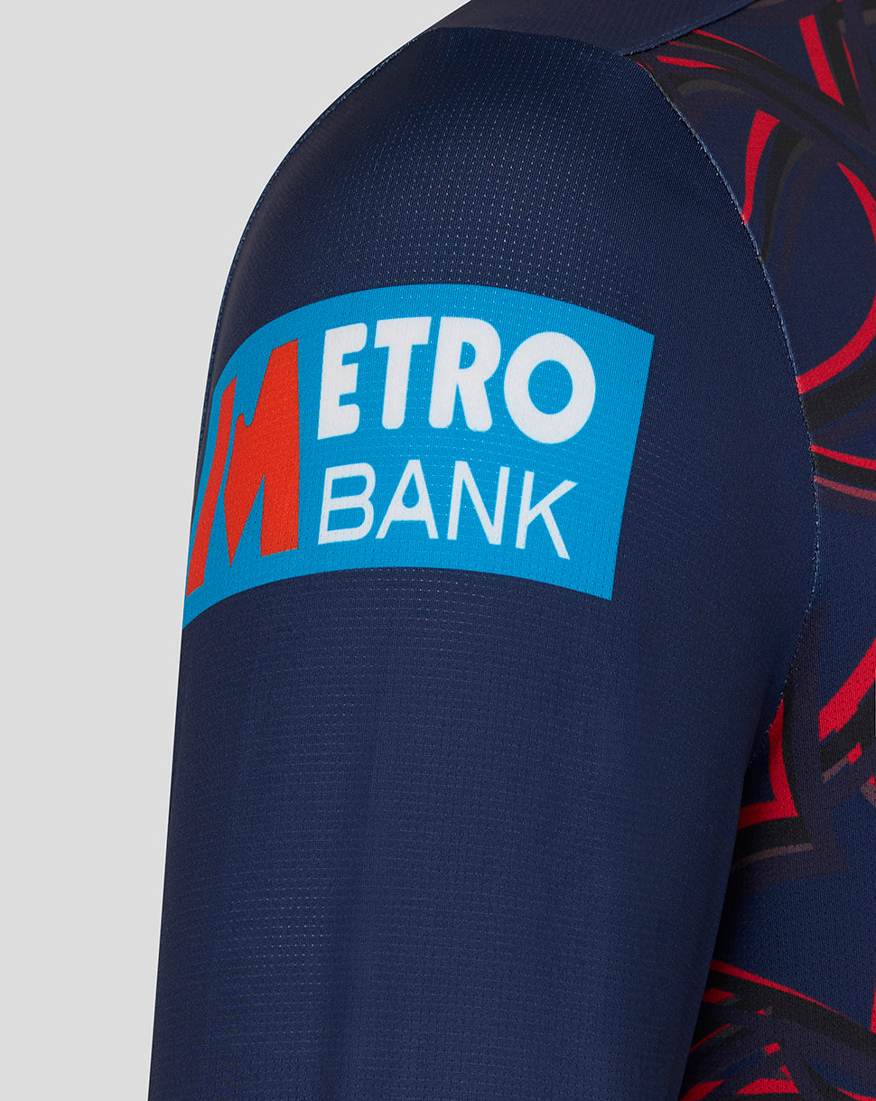 Close up of navy sleeve showing Metro Bank sponsor patch on the fabric