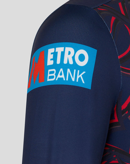Close up of navy sleeve showing Metro Bank sponsor patch on the fabric