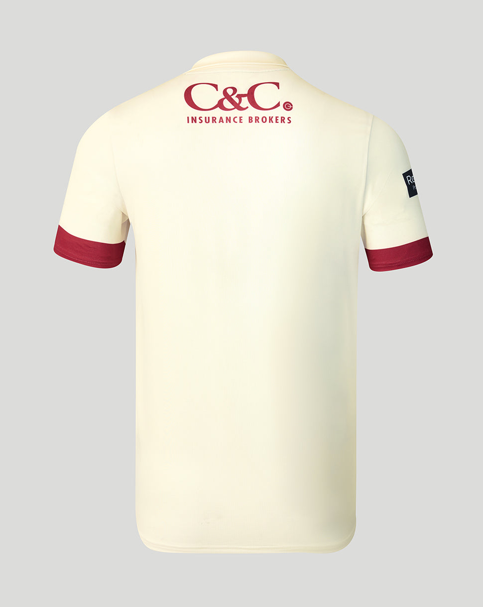 Back view of cream Lancashire County jersey with maroon cuffs and C&C Insurance Brokers logo at the neck.
